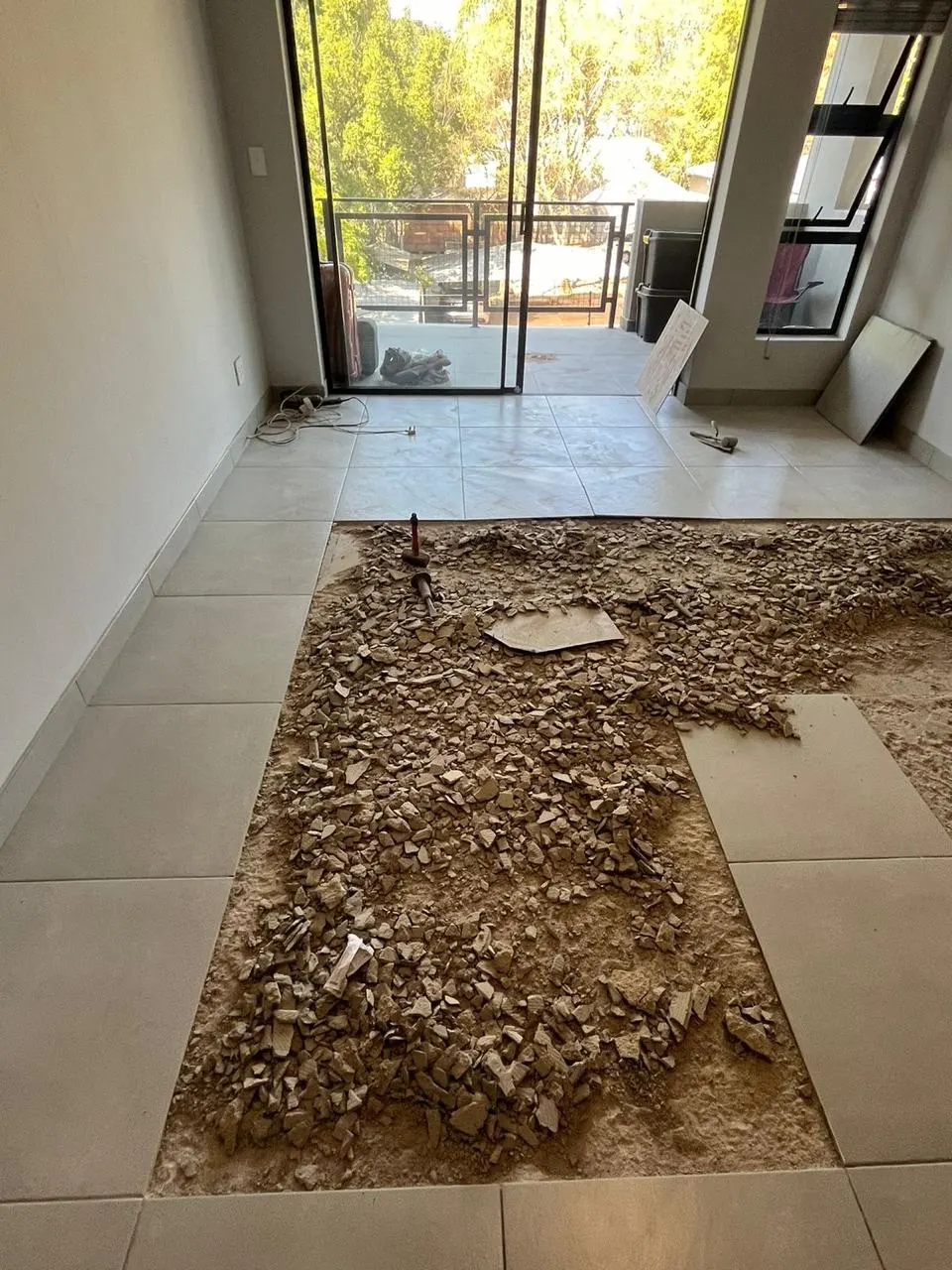 Open-plan tile replacement in progress