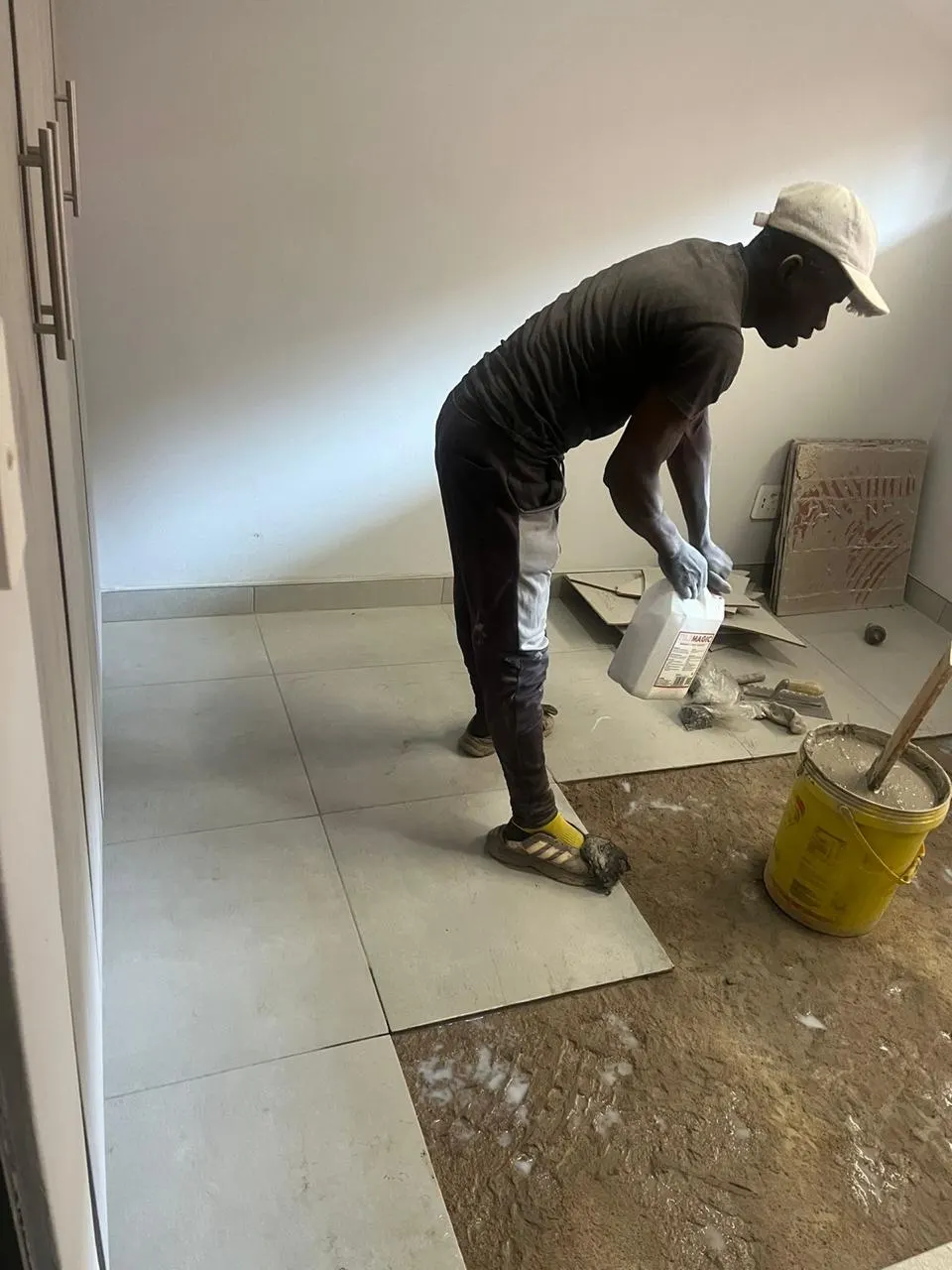 Large-format floor tiling in progress